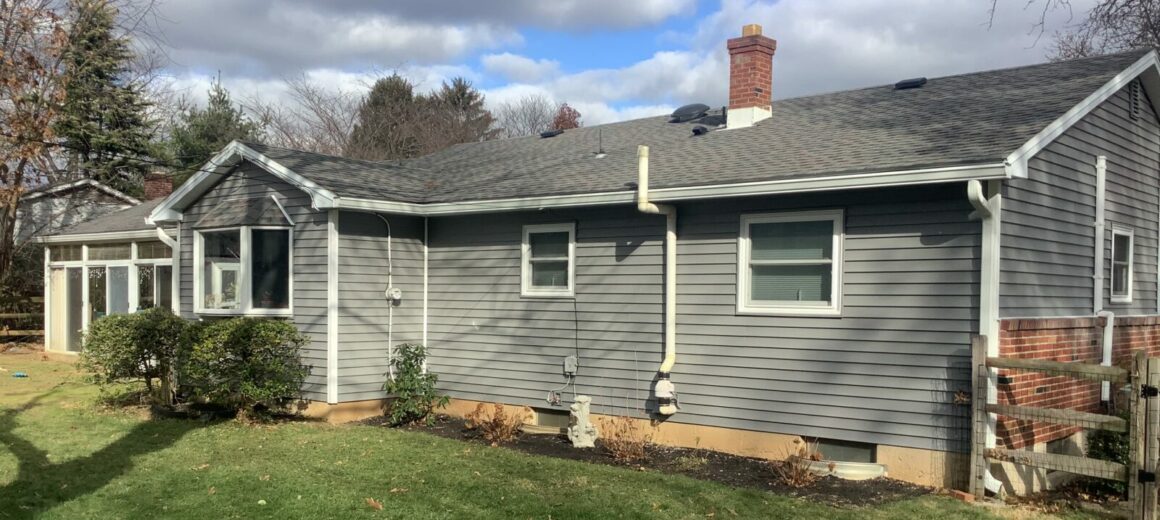 New Provia Cedar peaks vinyl siding color granite grey and white seamless gutters Macungie, PA