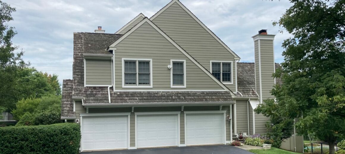 Replaced stucco siding with Hardie 8-1/4'' Cedarmill Fibercement, Monterey Taupe Siding; Newtown Square, PA, Chester County, PA; Installed August 2022