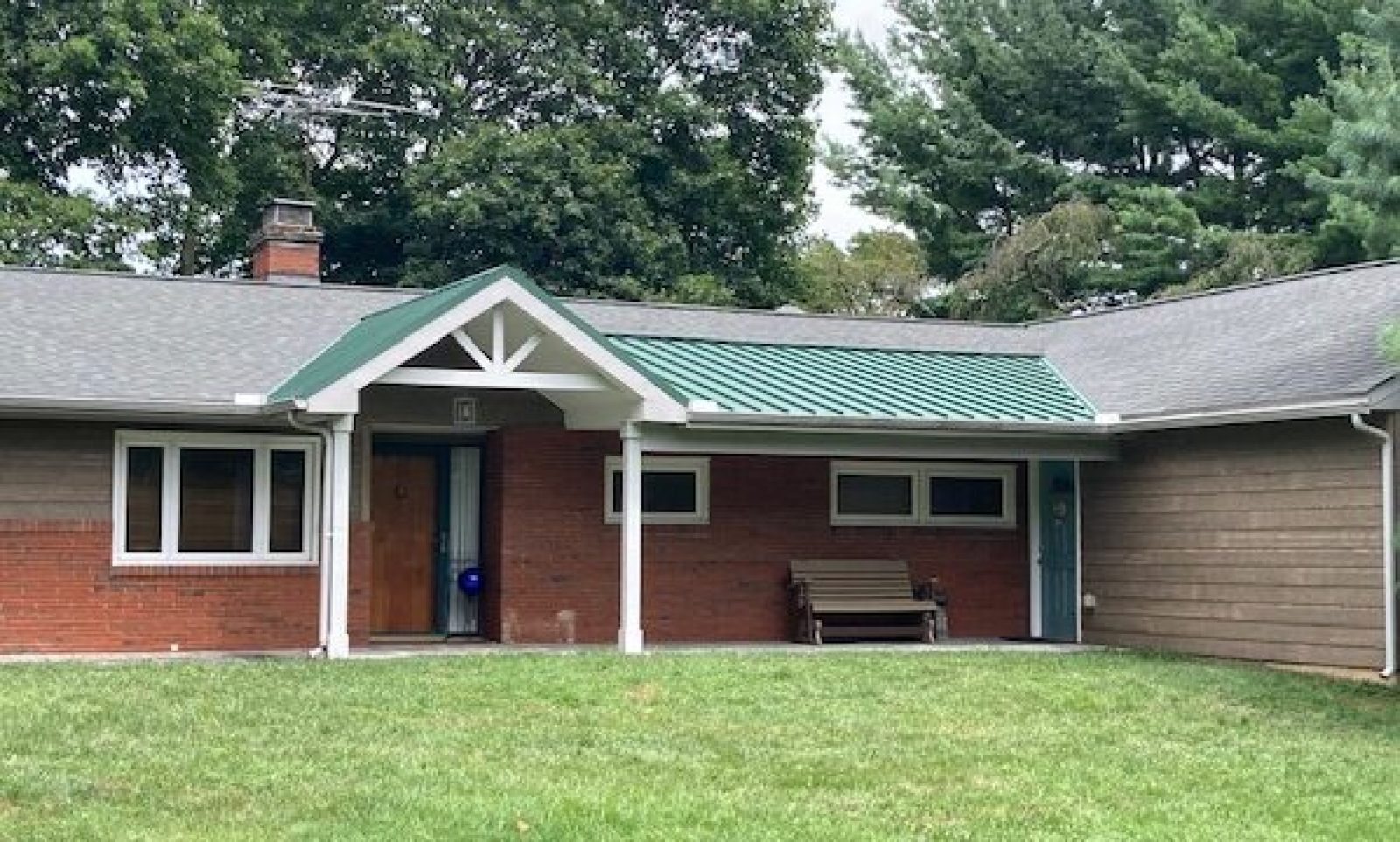 Green standing seam porch roof; installed in Delaware