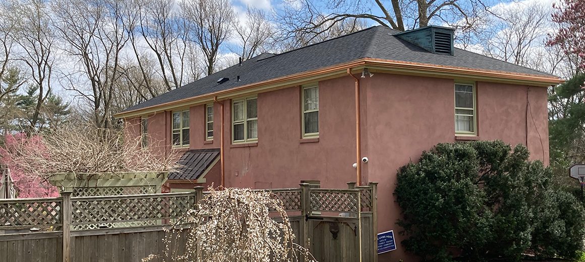 charcoal colored certainteed shingle roof with copper gutter